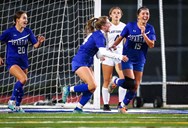 These girls soccer players managed key goals through rainy weather
